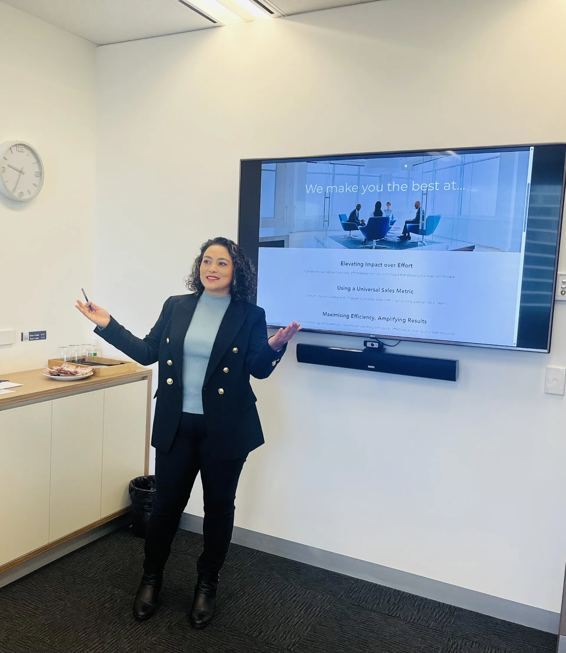 Dipti speaking at a corporate sales event